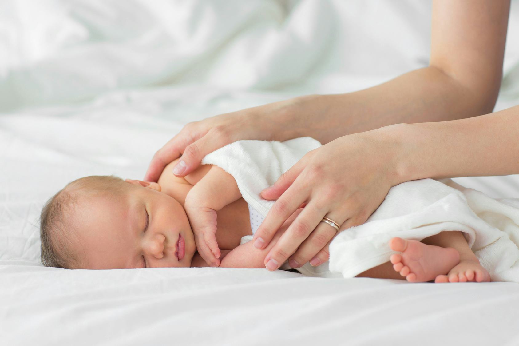 baby sleeping on side newborn