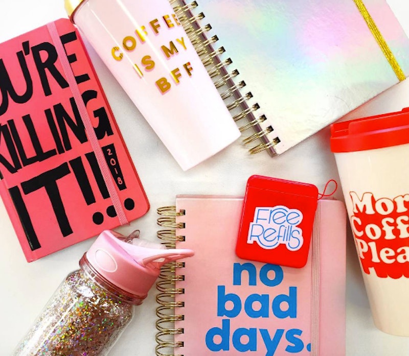 Three notebooks and three coffee mugs as a part of a back-to-school collection