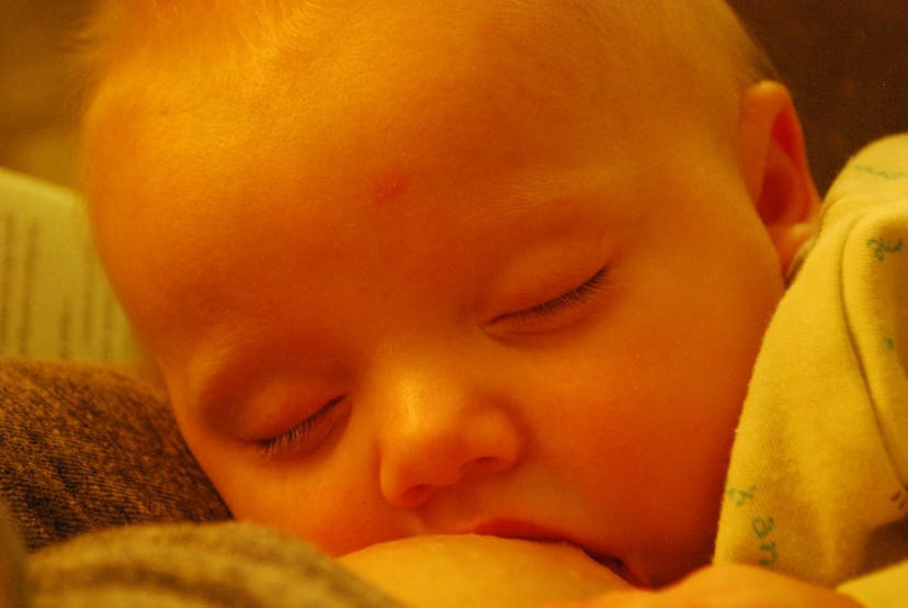 A baby breastfeeding 