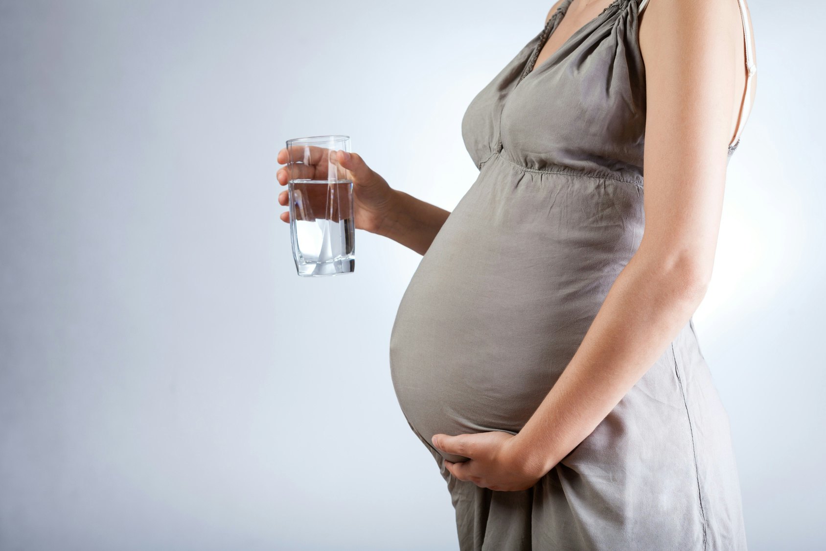throwing up clear liquid while pregnant