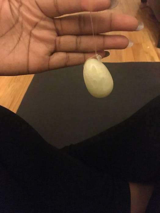 Female taking a picture of the Gwyneth Paltrow's Jade Vagina Egg after trying it