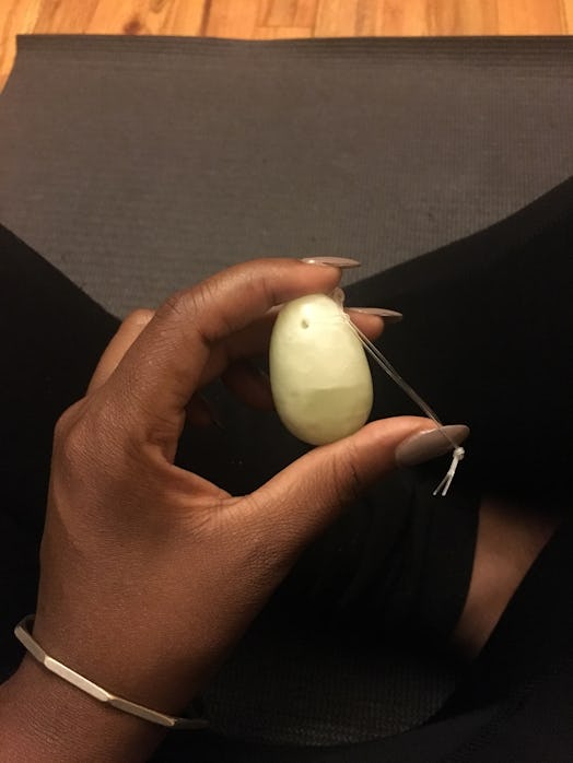A lady holding the Vagina Egg after using it for a week