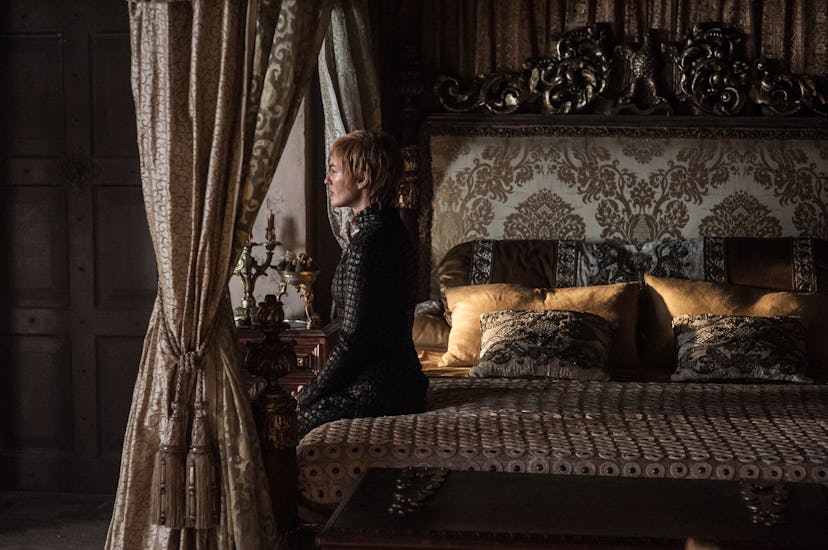 Cersei Baratheon sitting on the bed