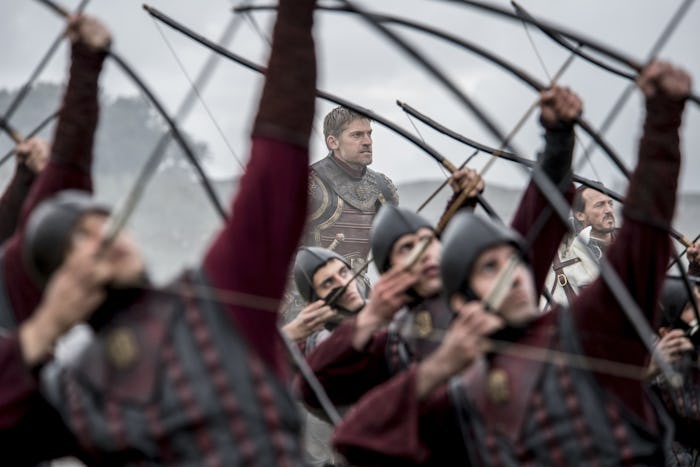 Soldiers from "Game of Thrones" holding bows and arrows pointed to the sky