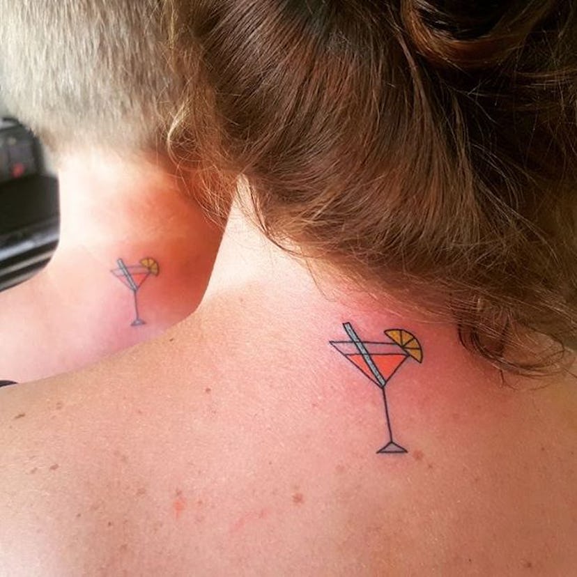 Man and woman with matching tattoos on their necks