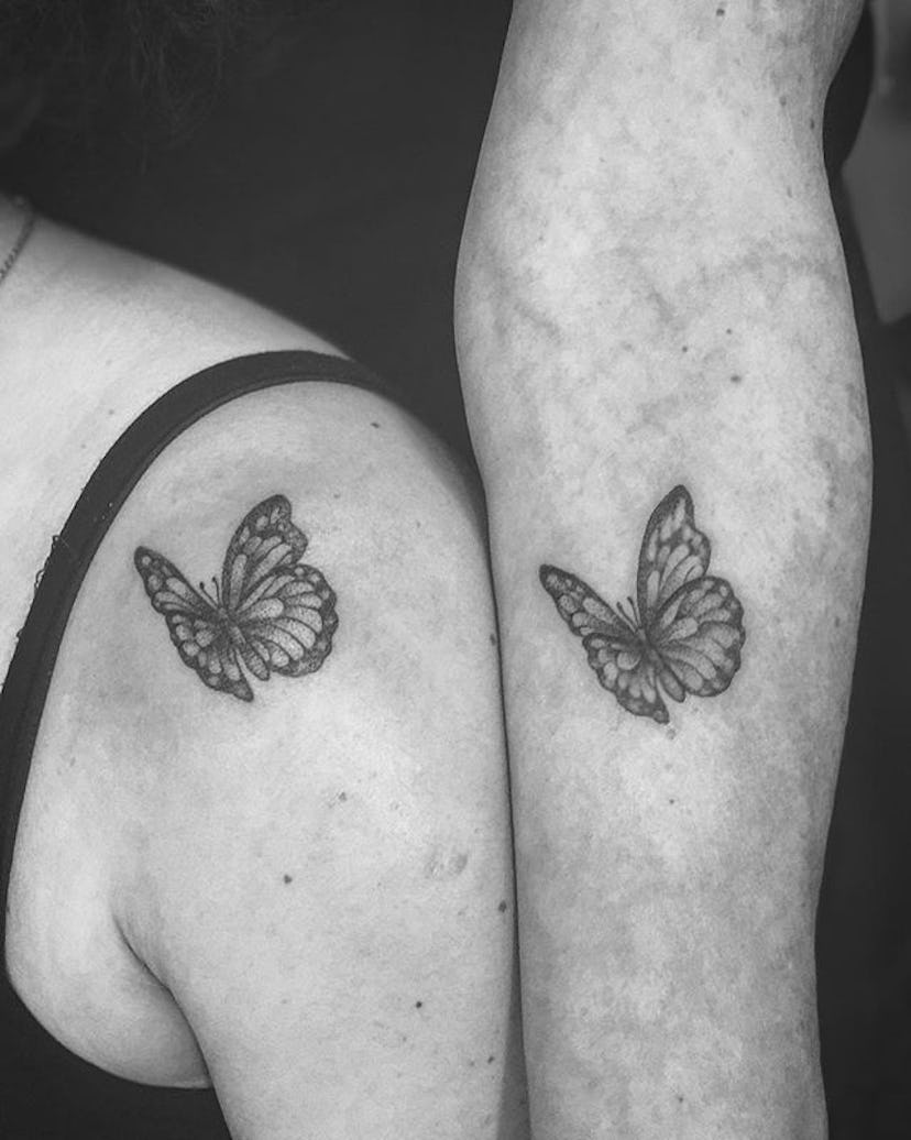 Two women with matching butterflies tattoos