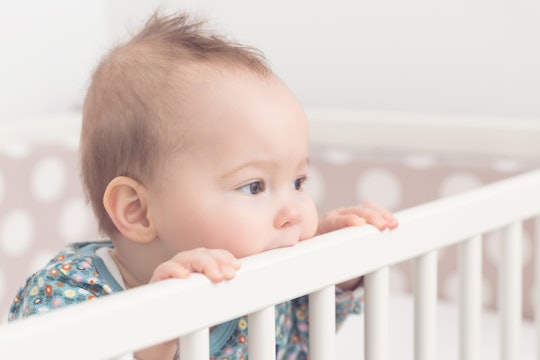 baby standing up in crib, not going to sleep