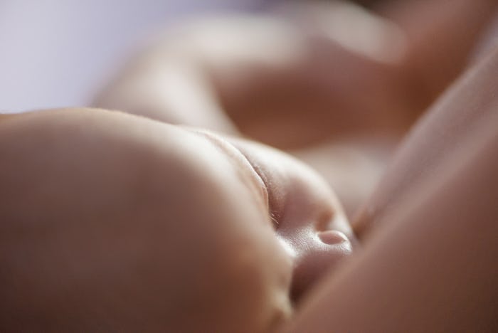 A mother breastfeeding her baby