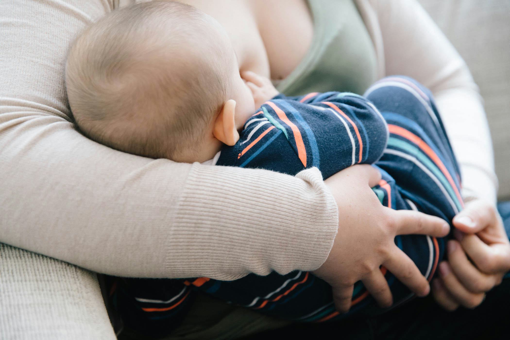 A mother breastfeeding her baby