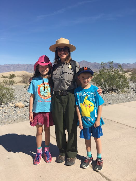 Two kids with a ranger at Death Valley National Park in CA.