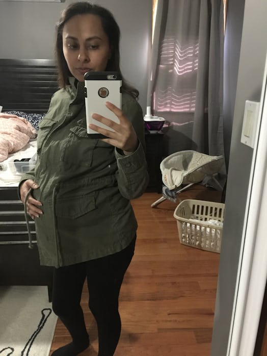 A woman taking a selfie during her second trimester