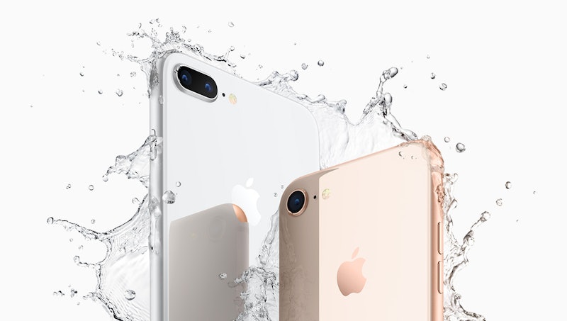 iPhone 8 and iPhone X  next to each other splashed by water