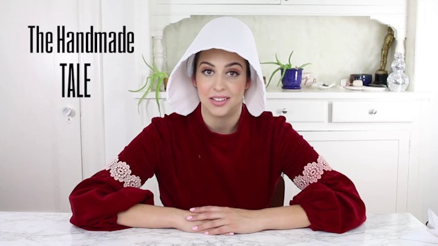 A woman dressed in a handmaid's tale costume