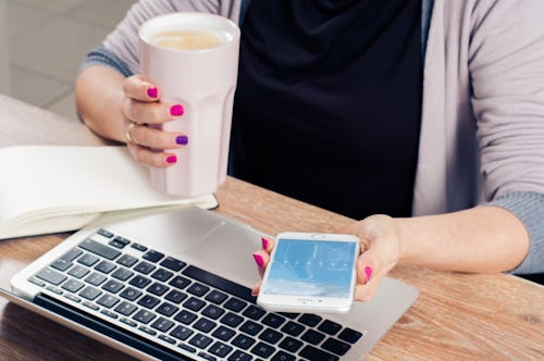 A woman who has an app Idea, but literally knows nothing about tech holding her phone and coffee nex...