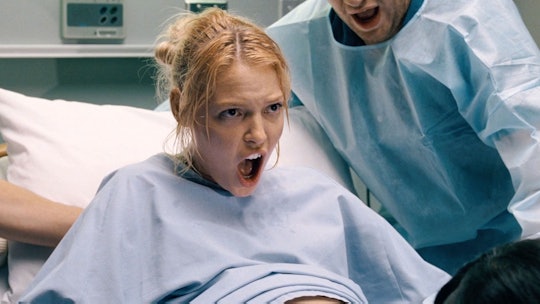 A pregnant woman screaming in the delivery room