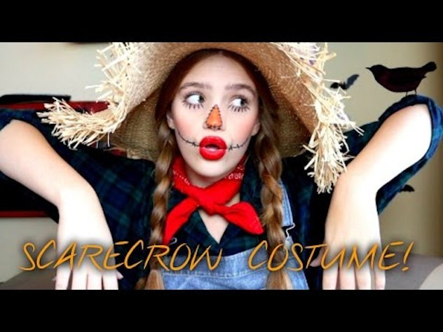A girl with a hat, scarf, and makeup look inspired by the scarecrows ready to take over the Hallowee...