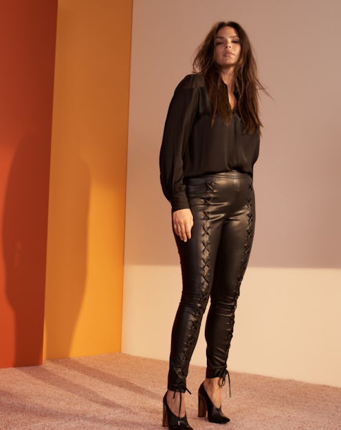 A model wearing a black shirt and leather pants from Lane Bryant x Prabal Gurung Plus-Size Collectio...