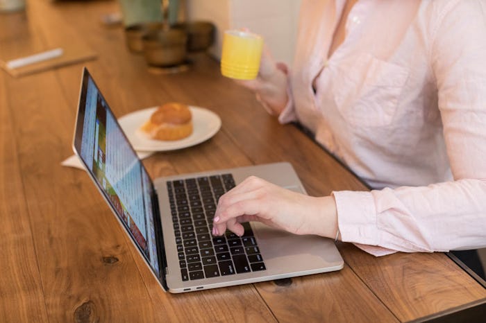 A woman making a business plan on her laptop