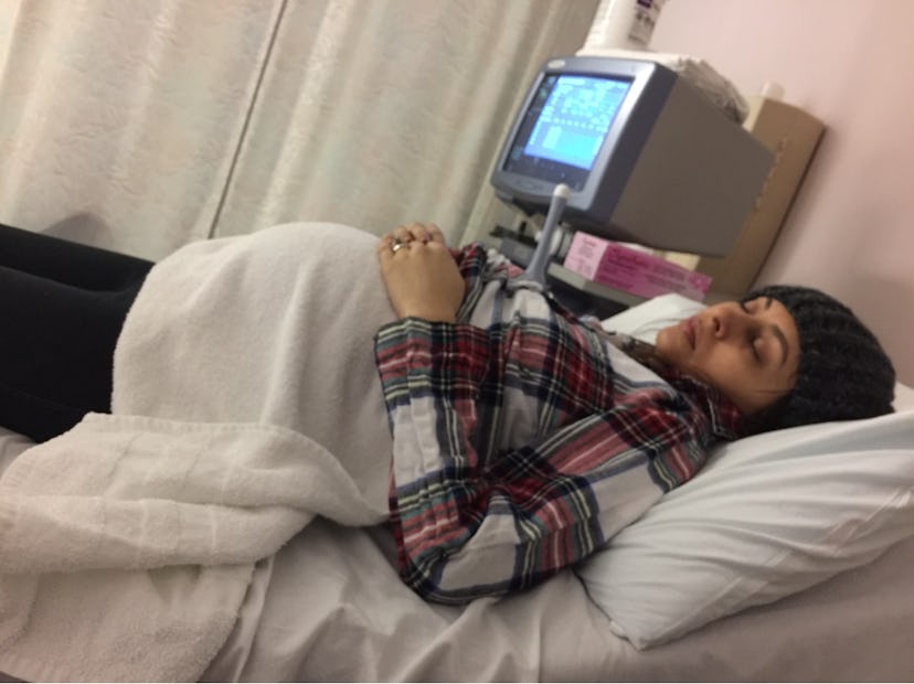 Yasmine Singh lying in a hospital bed