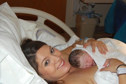 Maranda Davis lying down with her newborn baby on her chest