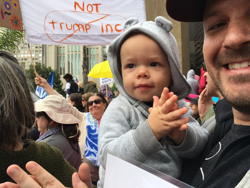 A dad with his baby at the Women's March