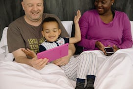 Parents going over the Modified Checklist for Autism in Toddlers (M-CHAT) with their kid