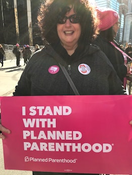 Ann at the New York City Women's March holding a sign "I stand with planned parenthood"