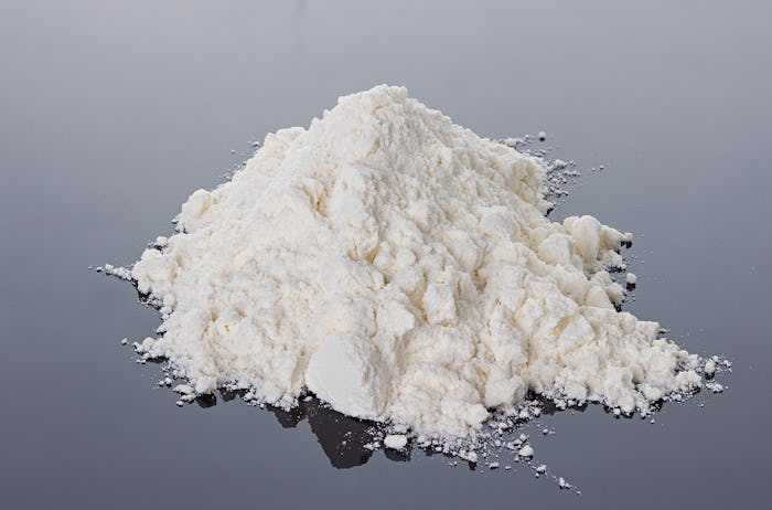 cocaine powder on a black surface