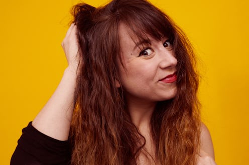 Red haired woman smiling for the camera