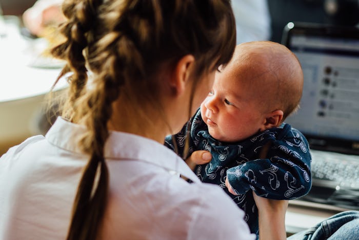 A mom holding her newborn baby