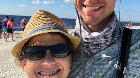 A selfie of a man and woman only showing half of their faces