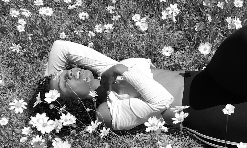 22 year old Jessica lying down in the grass