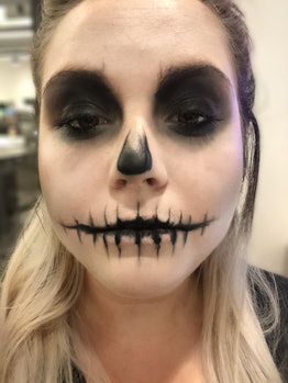 Using black eyeshadow and black eyeliner to create a skeleton makeup look for Halloween is key to a ...