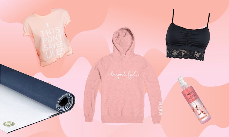 A pink pony graphic t-shirt, black yoga mat, pink pullover by Hoodie, and a black Astrid bralette wi...