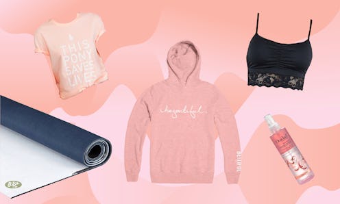 A pink pony graphic t-shirt, black yoga mat, pink pullover by Hoodie, and a black Astrid bralette wi...