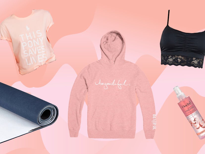 A pink pony graphic t-shirt, black yoga mat, pink pullover by Hoodie, and a black Astrid bralette wi...
