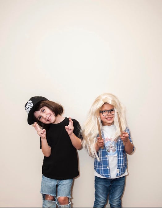 Two little girls in modern and stylish outfits posing for the picture published on Instagram