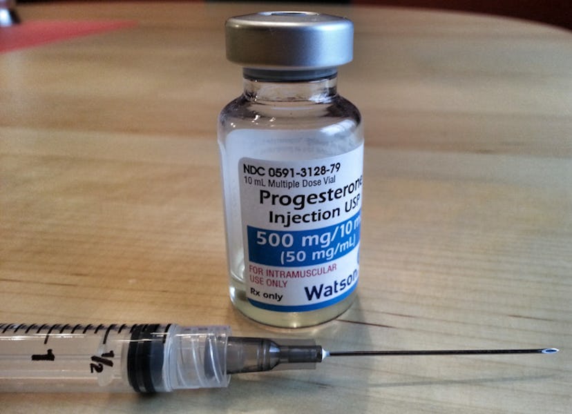 An injection and a Progesterone dose bottle