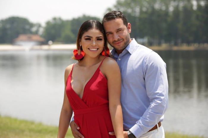 Fernanda in a red dress, and Jonathan in a blue shirt and beige pants from '90 Day Fiance'