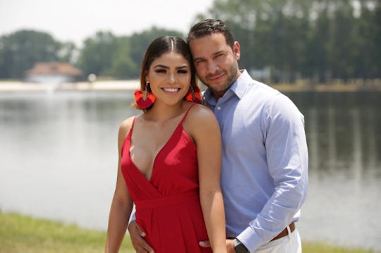 Fernanda in a red dress, and Jonathan in a blue shirt and beige pants from '90 Day Fiance'