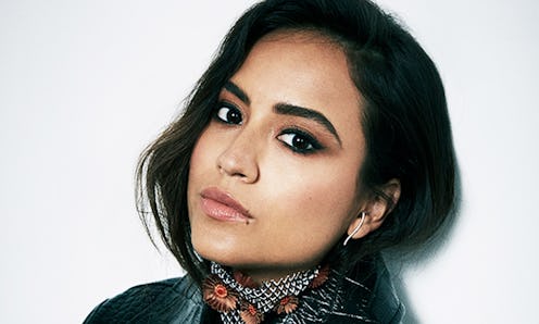 Cyndi Ramirez-Fulton posing in a leather jacket and checkered neck-chief