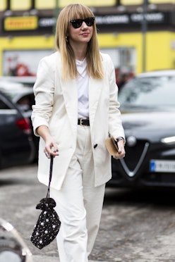 A woman wearing a white suit and a white shirt in Winter