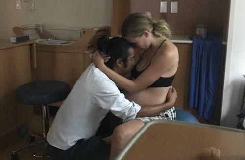 A man hugging his wife in labor