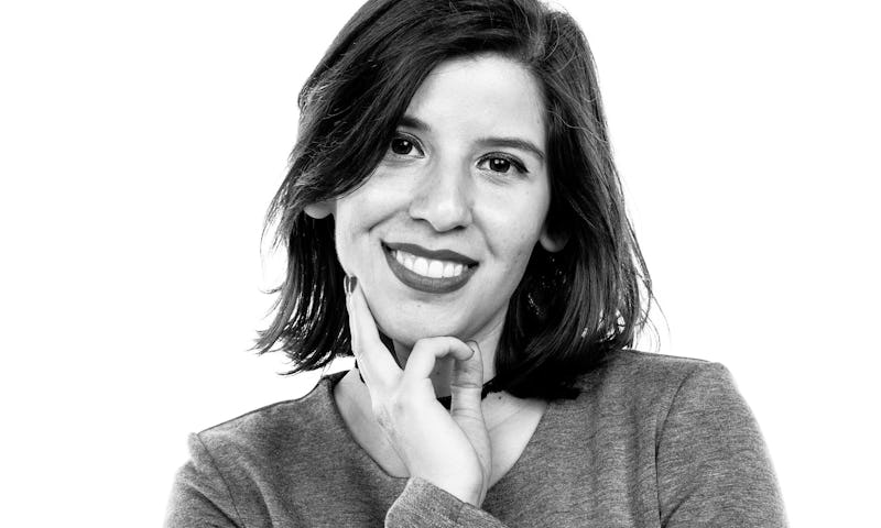 Carolina J. Moreno, a reporter at HuffPost posing for a photo