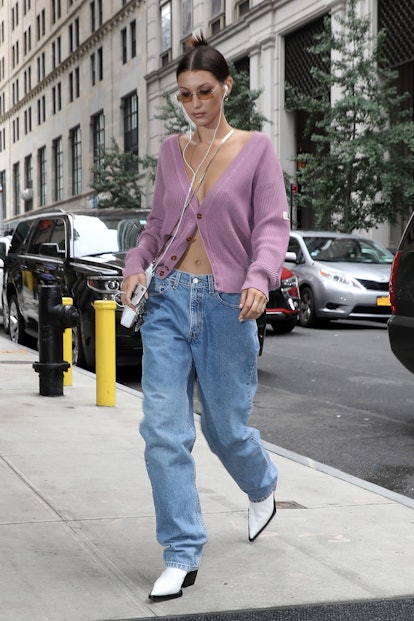 Bella Hadid wears cardigan and baggy, anti-skinny jeans in New York City.
