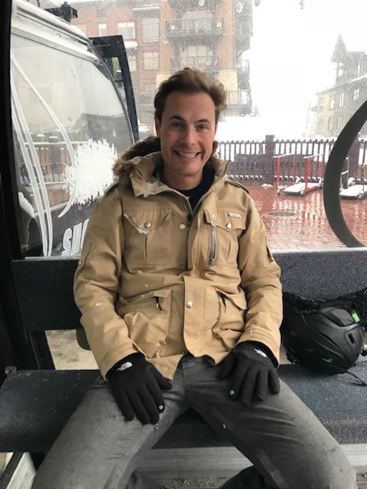 Erik Von Detten sitting in a gondola on a mountain