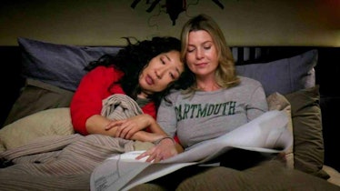 Meredith and Cristina cuddle in bed on 'Grey's Anatomy.'