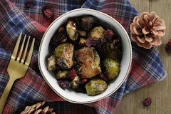 Honey-balsamic Brussels sprouts served in a bowl with a fork