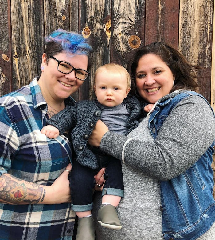 Dese'Rae L. Stage, who had pregnancy nightmares smiling next to her partner and her toddler