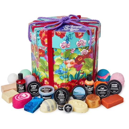 A Lush gift set with a large gift box and Lush's bath bombs and shower gels.